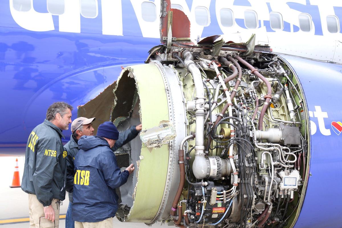 A NTSB investigator is on scene examining damage to the engine of the Southwest Airlines plane in this image released from Philadelphia, Pennsylvania, on April 17, 2018. (NTSB/Handout via Reuters)