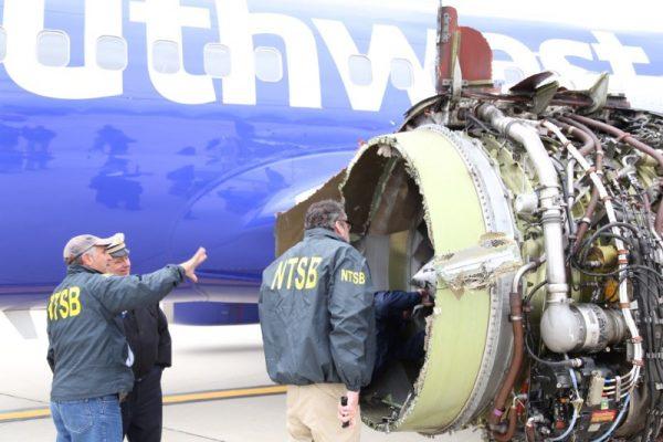 U.S. NTSB investigators are on scene examining damage to the engine of the Southwest Airlines plane in this image released from Philadelphia, Pennsylvania, U.S., April 17, 2018. (NTSB/Handout via Reuters)
