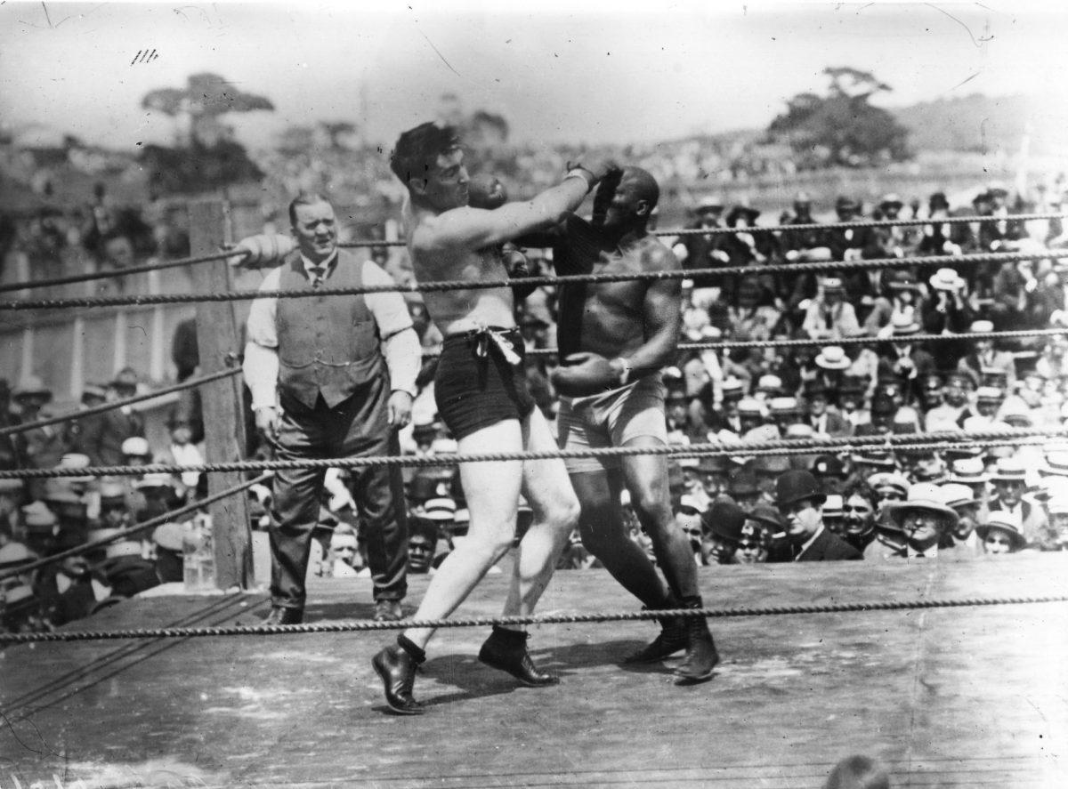 Jack Johnson, right, of the USA, world heavyweight title holder since 1908, in action against Jess Willard of the USA at Havana, Cuba in 1915. Willard took the title with a knock-out in the 26th round and held onto it until 1919. (Topical Press Agency/Getty Images)