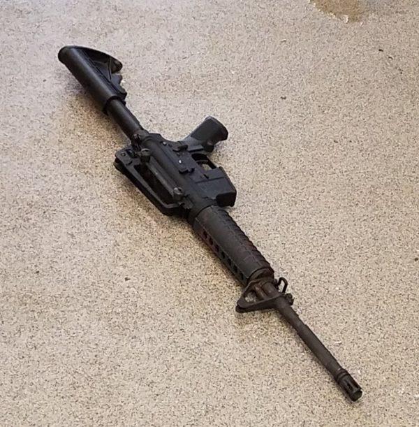 An AR-15 assault-type rifle lays on the pavement at the scene of a fatal shooting at a Waffle House restaurant, according to police officials, near Nashville, Tennesse, U.S., April 22, 2018. (Metro Nashville Police Department/Handout via Reuters)