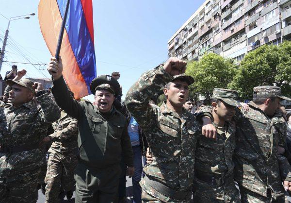 People march during a protest against the appointment of ex-president Serzh Sarksyan as the new prime minister in Yerevan, Armenia Apr. 23, 2018. (REUTERS/Vahram Baghdasaryan/Photolure)