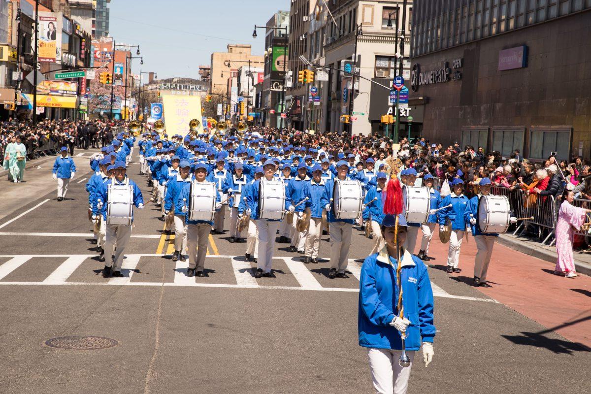 The Tian Guo marching band in a parade in Flushing, New York, on April 22, 2018. (Larry Dai/The Epoch Times)