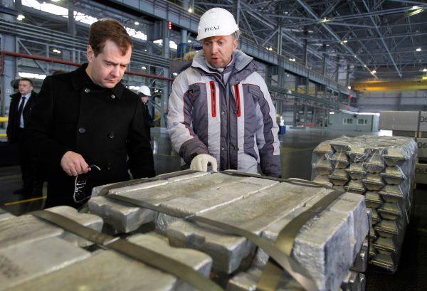Russia's then-President Dmitry Medvedev (L) listens to CEO of Russian metals giant UC Rusal Oleg Deripaska (R) as he visits Rusal aluminium smelter in Sayanogorsk, on March 11, 2011. (Dmitry Astakhov/AFP/Getty Images)