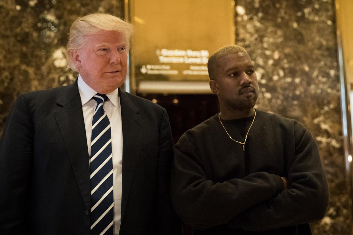 President-elect Donald Trump and Kanye West stand together in the lobby at Trump Tower in New York City on Dec. 13, 2016. (Drew Angerer/Getty Images)