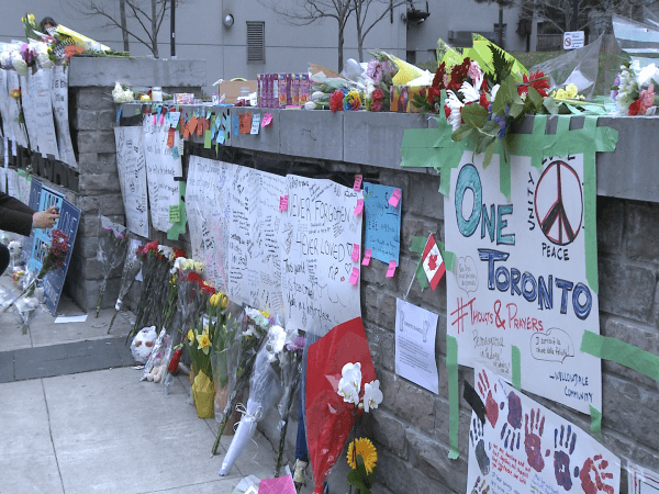 Tributes to the victims of the Toronto tragedy where several people were struck by a van are seen at a makeshift memorial site in Toronto on April 24, 2018. (Lingxi Zheng/The Epoch Times)
