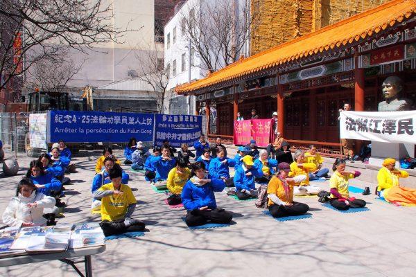 Falun Gong practitioners commemorate a peaceful appeal for freedom of belief that took place on April 25, 1999, in Beijing, China, at a gathering to raise awareness of the ongoing 19-year persecution of their faith by the Chinese regime, in Montreal’s Chinatown on April 21, 2018. (Yi Ke/The Epoch Times)