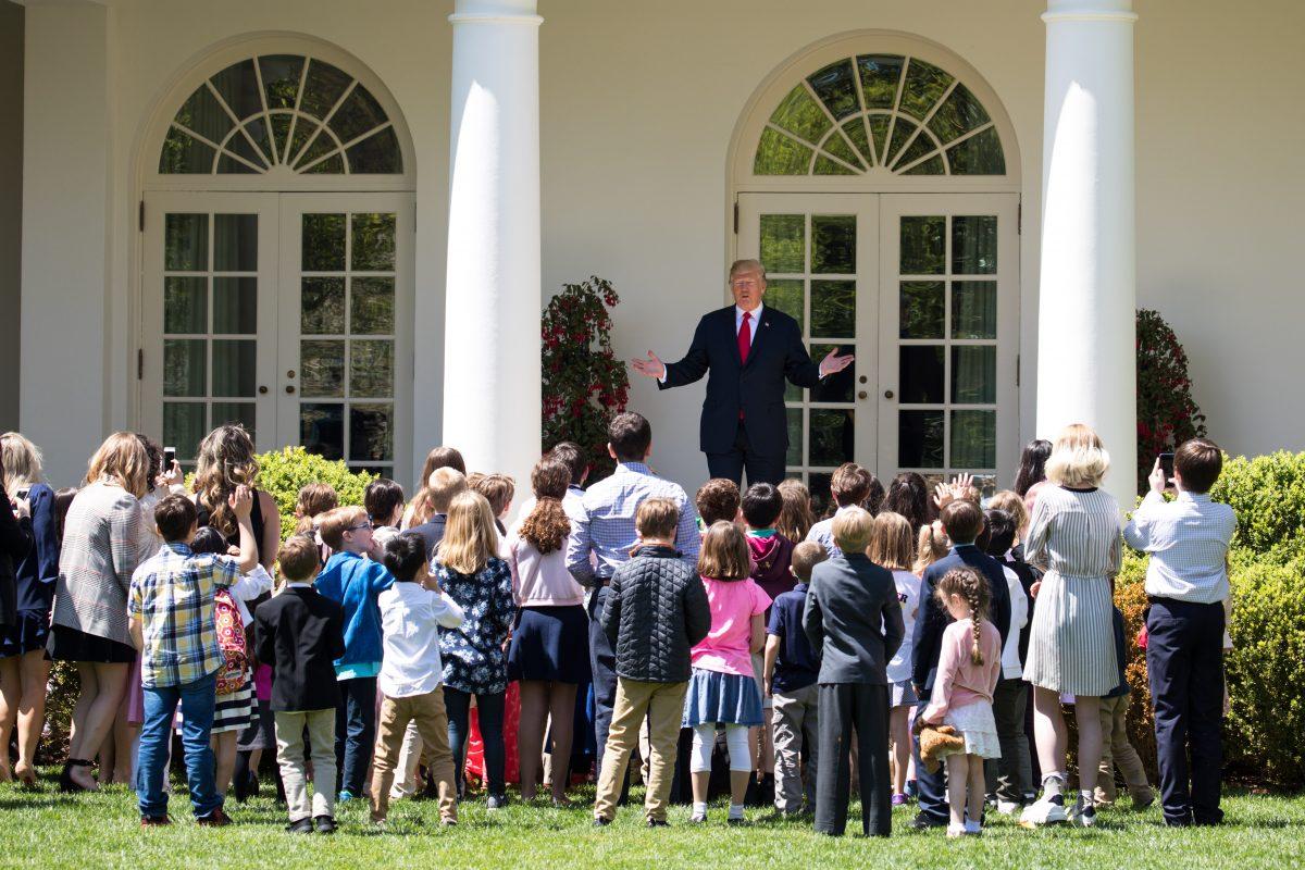 President Donald Trump welcomes children of press and staff in the Rose Garden during 'Take your Daughters and Sons to Work Day' at the White House in Washington on April 26, 2018. (Samira Bouaou/The Epoch Times)