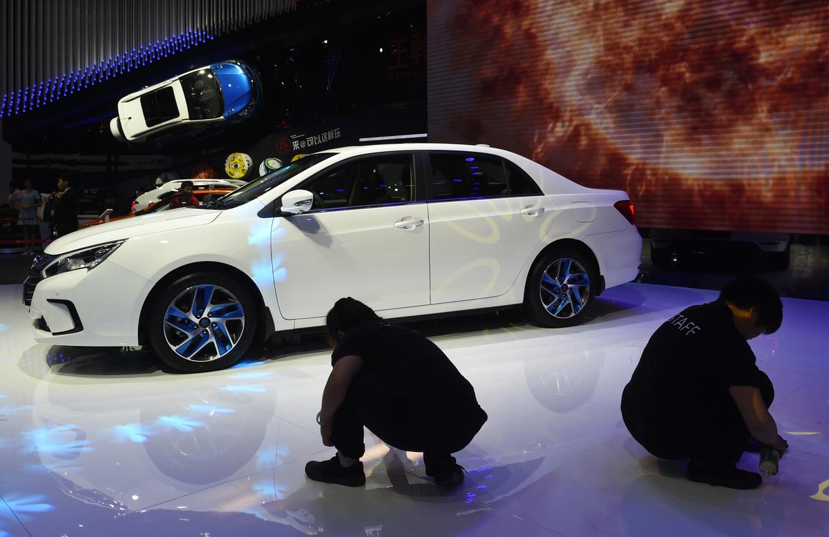 The domestic carmaker BYD Auto reveals the BYD Qin 100 hybrid car at the Beijing Auto Show in Beijing, China, on April 26, 2016. (Greg Baker/AFP/Getty Images)