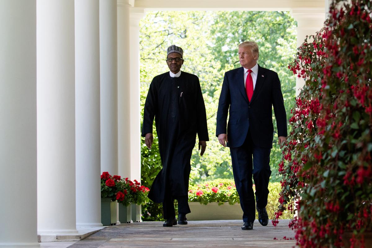 President Donald Trump walks with President Muhammadu Buhari of the Federal Republic of Nigeria in the Rose Garden of the White House in Washington on April 30, 2018. (Samira Bouaou/The Epoch Times)
