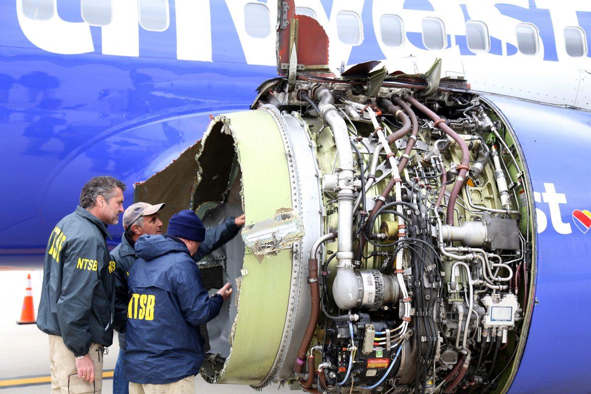 NTSB investigators examine damage to the CFM International 56-7B turbofan engine belonging Southwest Airlines Flight 1380 at Philadelphia International Airport on April 17, 2018. (Keith Holloway/National Transportation Safety Board via Getty Images)