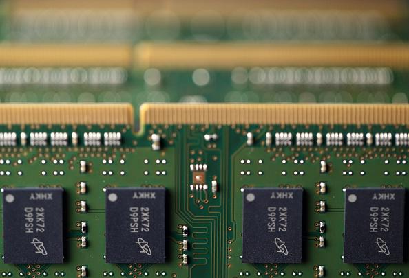 Micron Technology Inc. Double-Data-Rate Synchronous Random-Access Memory (SDRAM) chips are arranged for a photograph in Tokyo, Japan, on July 15, 2015. (Tomohiro Ohsumi/Bloomberg via Getty Images)