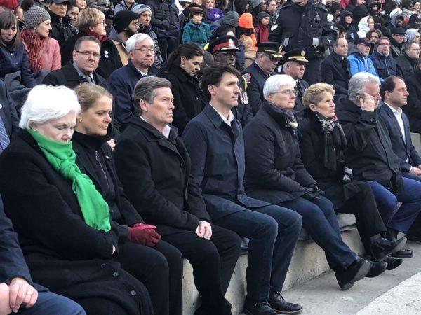 Canadian Prime Minister Justin Trudeau (C) along with other officials including Governor General Julie Payette (2-L), Toronto Mayor John Tory (3-L), Ontario PremierKathryn Wynne (3-R), and Quebec PremierPhilippe Couillard (2-R) attend a vigil on April 29, 2018 in Toronto to commemorate victims of the April 23 van attack incident that took the lives of 10 people. (Omid Ghoreishi/The Epoch Times)