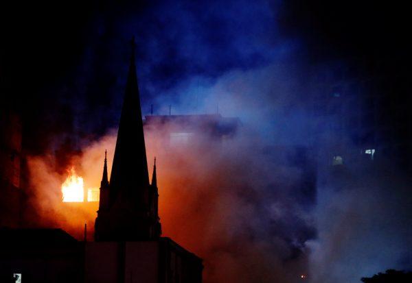 Flames from a building fire are seen in downtown Sao Paulo. (Reuters/Leonardo Benassatto)