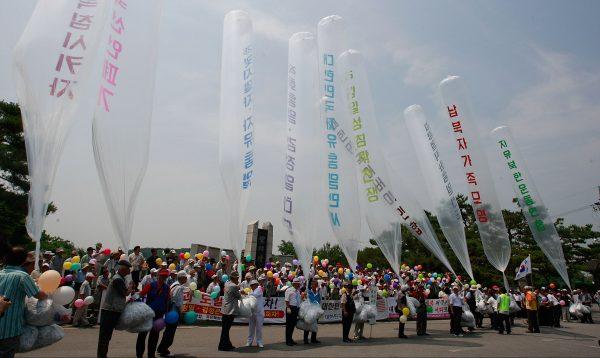 South Korean conservative activists, including North Korean defectors, prepare to release helium balloons carrying 'propaganda' leaflets destined for North Korea to mark the 60th Anniversary of the Korean War at in Paju on June 25, 2010 in Seoul, South Korea. (Chung Sung-Jun/Getty Images)