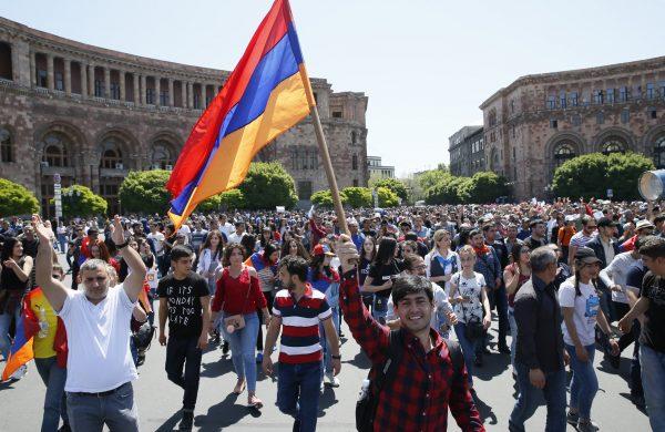 Armenian opposition supporters walk on the street. (Reuters/Gleb Garanich)