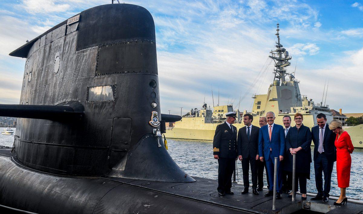 Former Australian Prime Minister Malcolm Turnbull, President of France Emmanuel Macron, along with Australian ministers on the submarine HMAS Waller at Garden Island, in Sydney, on May 2, 2018. (AAP/Brendan Esposito/via Reuters)