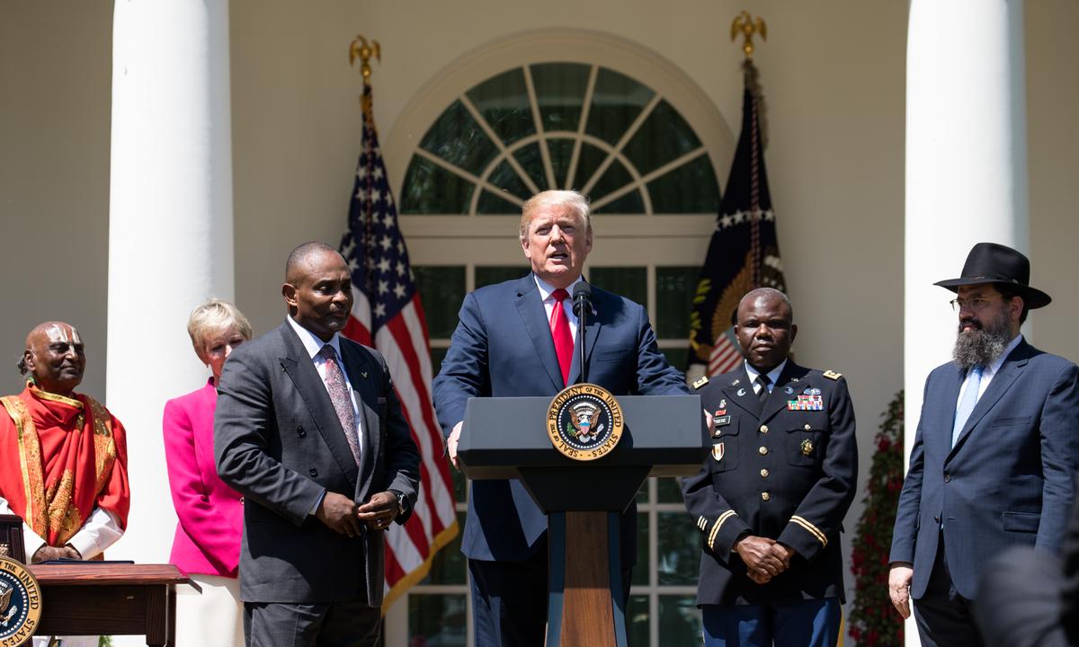 President Donald Trump attends the National Day of Prayer in the Rose Garden of the White House in Washington on May 3, 2018. (Samira Bouaou/The Epoch Times)