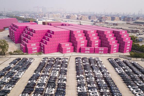 Vehicles stand next to Ocean Network Express Pte. shipping containers at a port in this aerial photograph taken above Shanghai, China, on Monday, April 30, 2018. (Qilai Shen/Bloomberg via Getty Images)