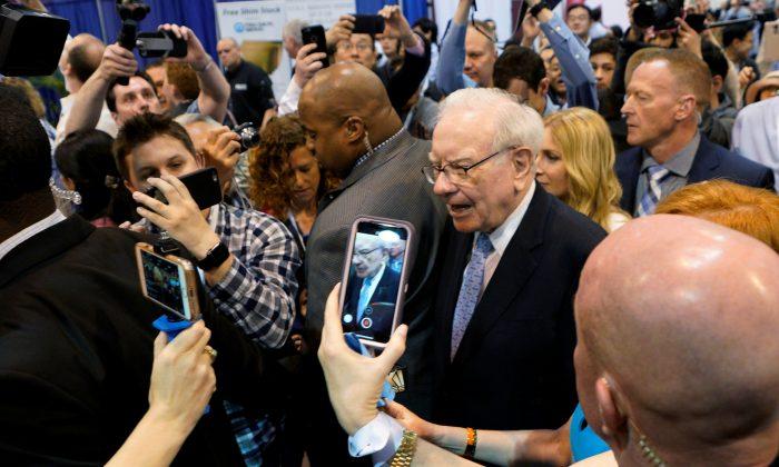 Buffett’s Berkshire Swings to Rare Loss but Performs Better