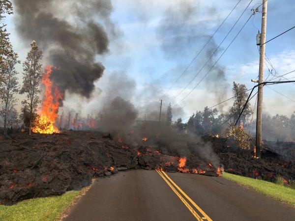 Lava advances along a street near a fissure in Leilani Estates, on Kilauea Volcano's lower East Rift Zone, Hawaii, on May 5, 2018. U.S. (Geological Survey/Handout via REUTERS)