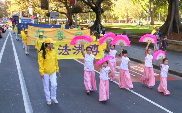 Australian Falun Dafa practitioners participate in a Falun Dafa Day parade in Sydney on May 5, 2018. (Linda Zhang/The Epoch Times)