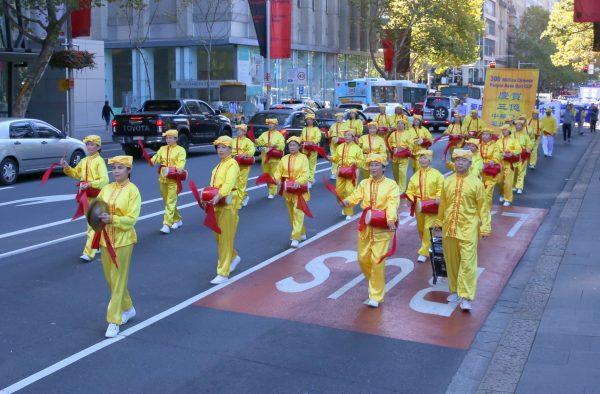 Australian Falun Dafa practitioners play the traditional Chinese waist drum during a Falun Dafa Day celebration in Sydney on May 5, 2018. (Linda Zhang/The Epoch Times)