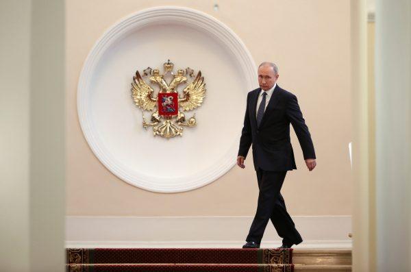 Russian President Vladimir Putin walks before an inauguration ceremony at the Kremlin in Moscow, Russia May 7, 2018. (Sputnik/Sergei Bobylyov/Pool via Reuters)