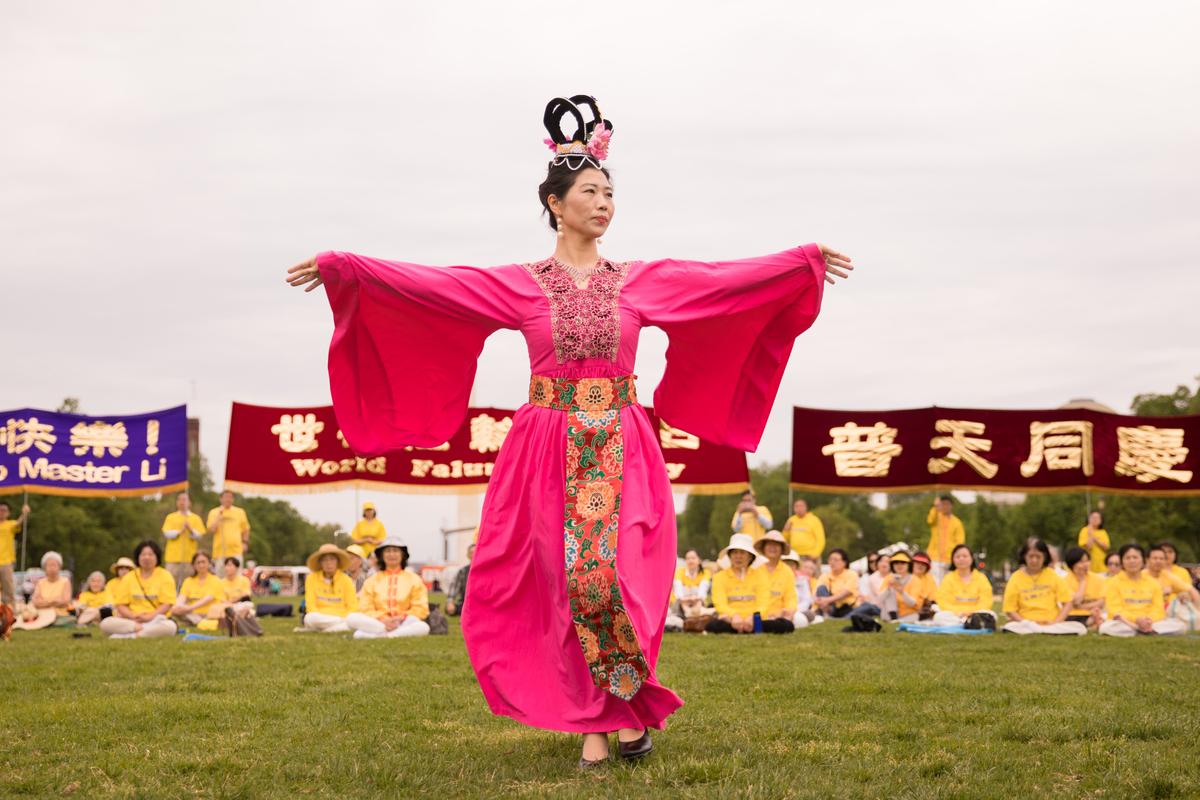 A Falun Dafa practitioner models clothing from an earlier period in Chinese civilization at the World Falun Dafa Day celebration on the National Mall in Washington on May 5, 2018. (Samira Bouaou/Epoch Times)