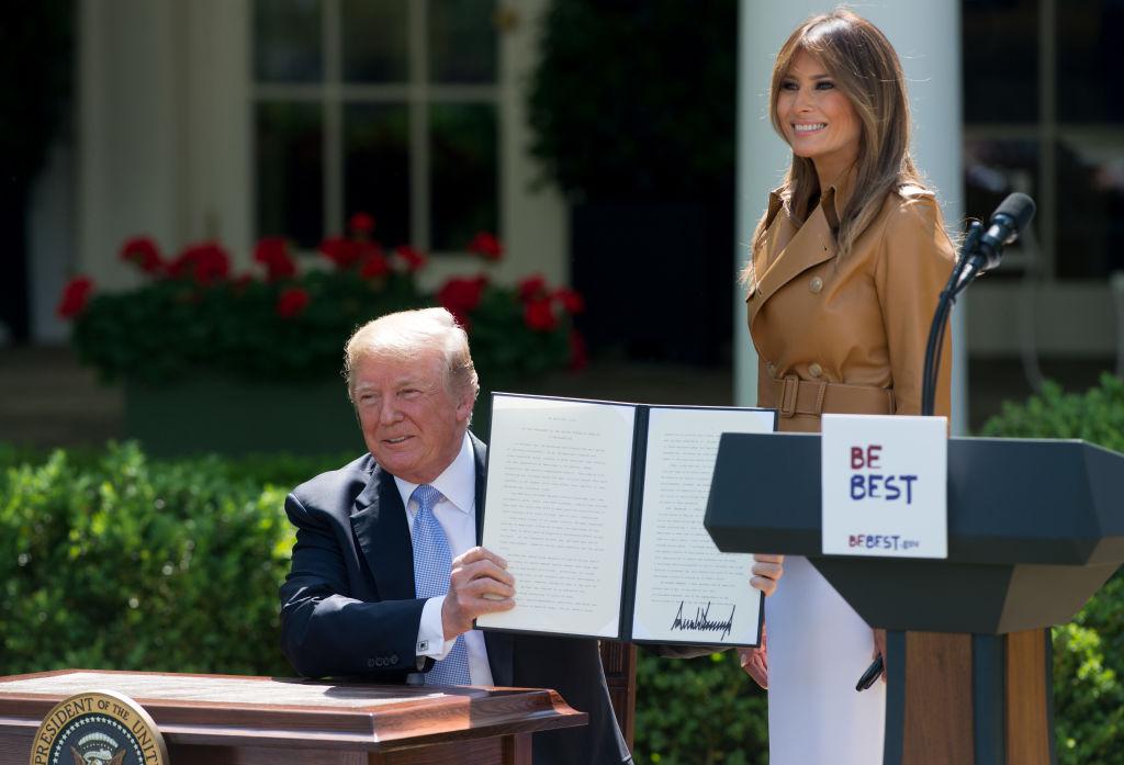 President Donald Trump signs a proclamation alongside First Lady Melania Trump after she announced her "Be Best" children's initiative in the Rose Garden of the White House on May 7. (SAUL LOEB/AFP/Getty Images)