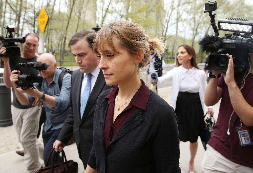 Actress Allison Mack (C) departs the United States Eastern District Court after a bail hearing in relation to the sex trafficking charges filed against her on May 4, 2018, in the Brooklyn borough of New York City. (Jemal Countess/Getty Images)