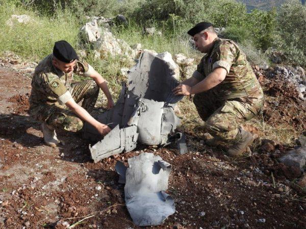 Lebanese soldiers inspect the remnants of a missile in Haberiyeh, Lebanon on May 10. (Reuters/Karamallah Daher)
