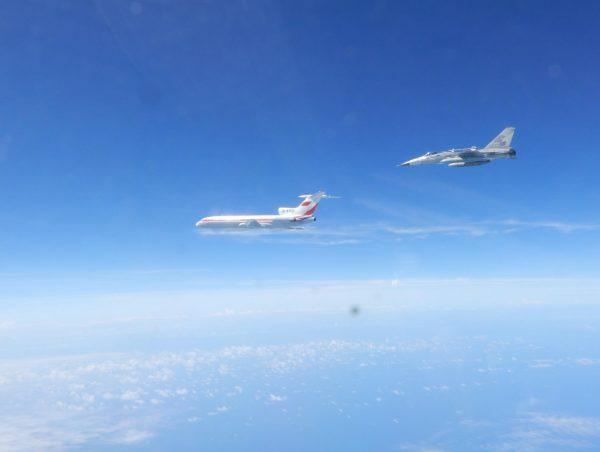 Taiwanese Air Force F-CK-1 fighter jet flies alongside a Chinese People's Liberation Army Air Force (PLAAF) Tu-154 electronic surveillance aircraft on May 11, 2018, in the western Pacific. (Photo released by Taiwan ROC Air Force )