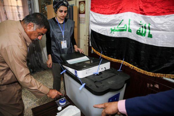 An Iraqi voter dips his finger in ink before casting his ballot at a poll station in the capital Baghdad's Karrada district on May 12, 2018, as the country votes in the first parliamentary election since declaring victory over the ISIS group. (Sabah Arar/AFP/Getty Images)