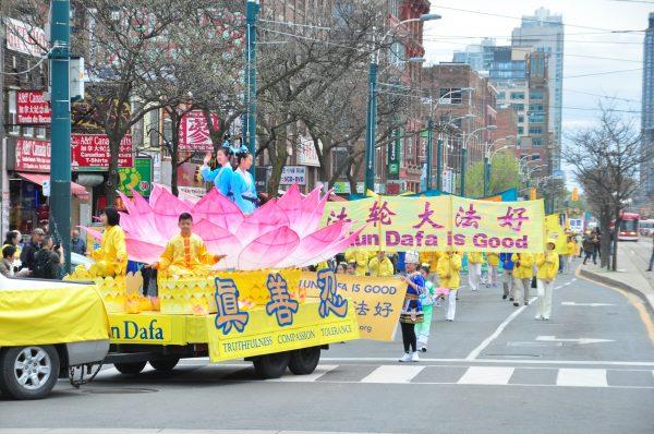 Falun Dafa adherents perform in a parade to celebrate Falun Dafa Day in Toronto on May 12, 2018. (Evan Ning/The Epoch Times)