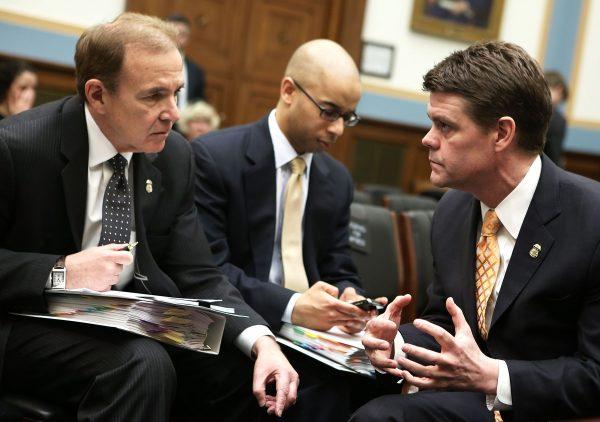 Gary Mead (L), executive associate director of enforcement and removal operations, talks to then-ICE Director John Morton (R) and Elliot Williams, director of congressional relations of ICE, prior to a hearing in Washington on March 19, 2013. (Alex Wong/Getty Images)