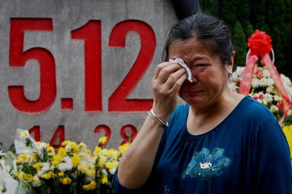 A relative of earthquake victims cries as she mourn at the ruins of earthquake-hit Beichuan county on May 11, 2009 in Mianyang of Sichuan Province, China. (Feng Li/Getty Images)