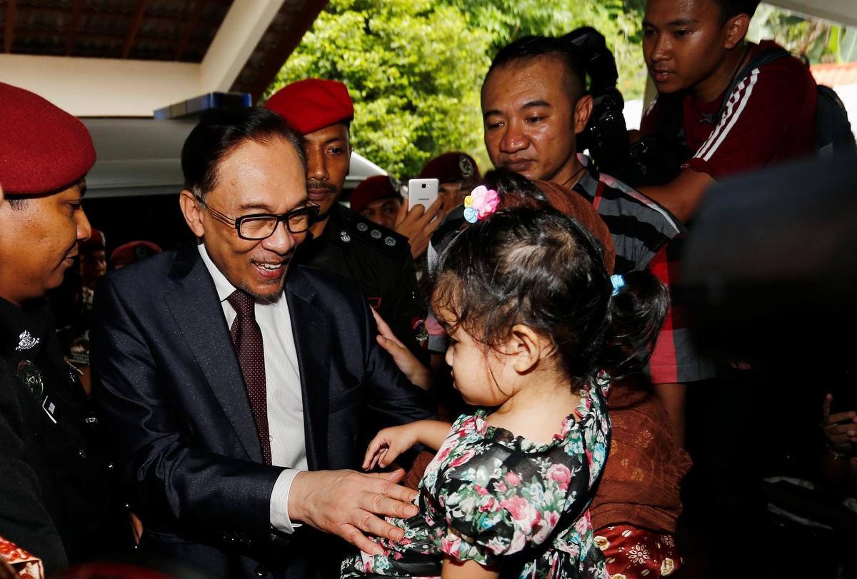 Malaysia’s Anwar Walks Free After Royal Pardon, Meets Mahathir