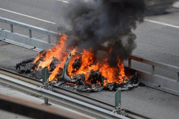 An electric-powered Tesla car burns after a crash on the Swiss A2 motorway on Monte Ceneri near Bellinzona, Switzerland, on May 10, 2018. (Rescue Media/Reuters)