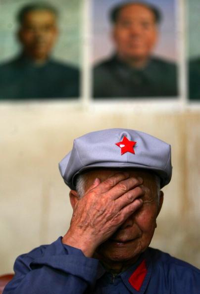 94-year-old veteran Liu Jiaqi, who joined the Red Army and the Long March in 1934, breaks into tears before attending the launching ceremony of "Retracing the Long March" activity July 22, 2006, in Ruijin, Jiangxi Province, central China. (China Photos/Getty Images)