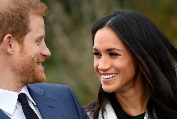 Britain's Prince Harry poses with Meghan Markle in the Sunken Garden of Kensington Palace, London, Britain, November 27, 2017. (Reuters/Toby Melville)