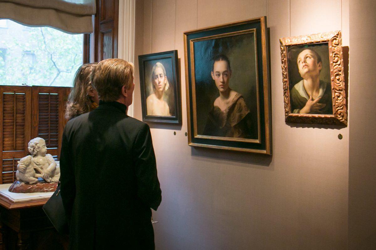 (L–R) "Portrait of a Young Woman" by Rachel Li (b. 1995), "Untitled" by Will St. John (b. 1980), and "Portrait of a Boy" by Bolognese School artist (17th century) at the Robert Simon Fine Art gallery on May 10, 2018. (Milene Fernandez/The Epoch Times)