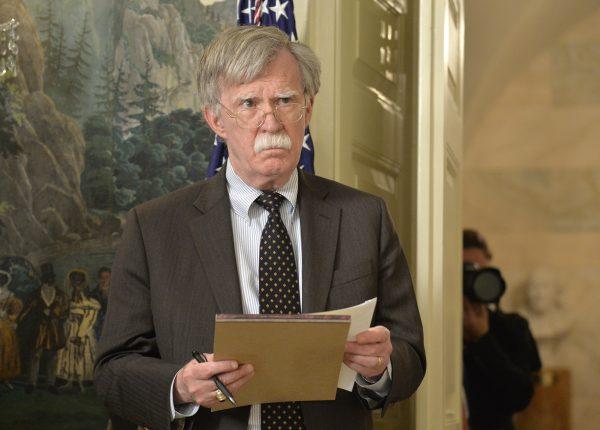 National Security Advisor John Bolton listens to remarks by U.S. President Donald Trump as he speaks to the nation in Washington, DC on April 13, 2018. (Mike Theiler - Pool/Getty Images)