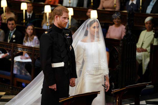 Prince Harry and Meghan Markle in St George's Chapel at Windsor Castle for their wedding in Windsor, Britain, May 19, 2018. (Dominic Lipinski/Pool via Reuters)