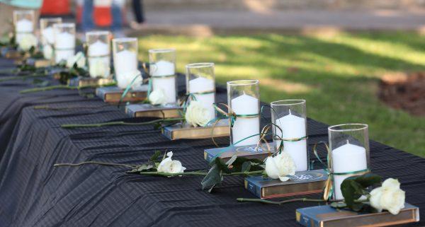 Candles line a table during a vigil held at the Texas First Bank after a shooting left several people dead at Santa Fe High School in Santa Fe, Texas, U.S., May 18, 2018. (Reuters/Trish Badger)