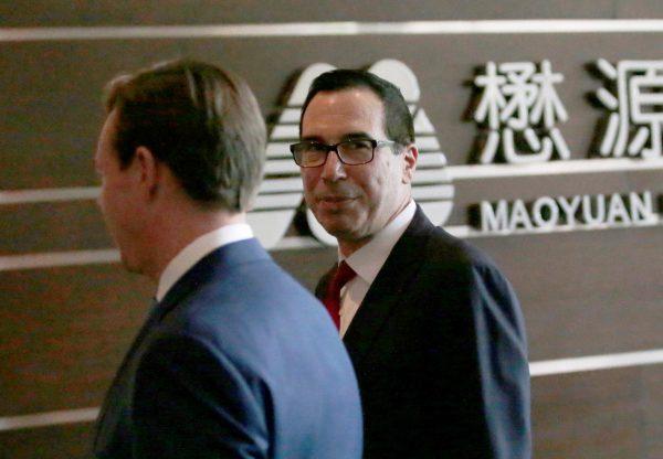 U.S. Treasury Secretary Steven Mnuchin (R) is seen as he and a U.S. delegate for trade talks with China arrive at a hotel in Beijing, China on May 3, 2018. (Jason Lee/Reuters)