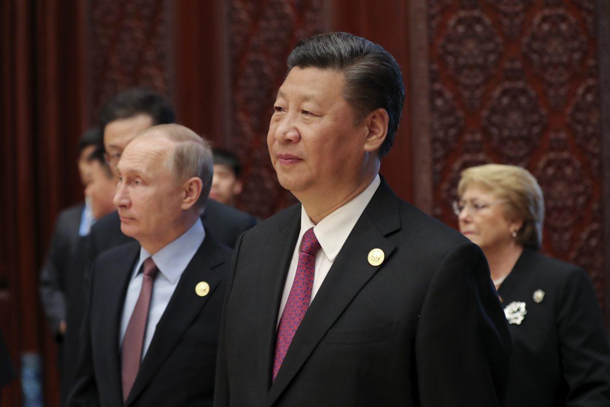 Chinese leader Xi Jinping and Russia's President Vladimir Putin (L) attend a summit for the Belt and Road Initiative, at the International Conference Center in Yanqi Lake, north of Beijing, on May 15, 2017. (Lintao Zhang/AFP/Getty Images)