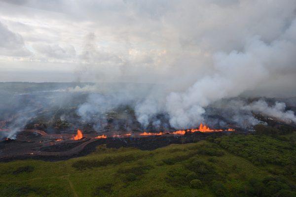 Lava flows downhill in this helicopter overflight image of Kilauea Volcano's lower East Rift zone during ongoing eruptions in Hawaii on May 19, 2018. (USGS/Handout via REUTERS)