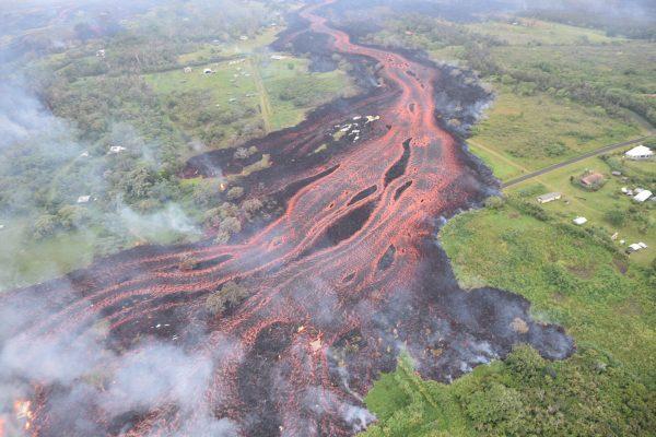 Lava flows downhill, in this image from a helicopter overflight of Kilauea Volcano's lower East Rift zone, during ongoing eruptions of the Kilauea Volcano in Hawaii on May 19, 2018. (USGS/Handout via Reuters)