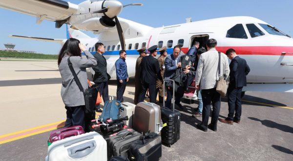 South Korean journalists, who will visit the nuclear testing site at Punggye-ri, arrive at Kalma airport in Wonsan, North Korea, on May 23, 2018. (News1/Pool via Reuters)