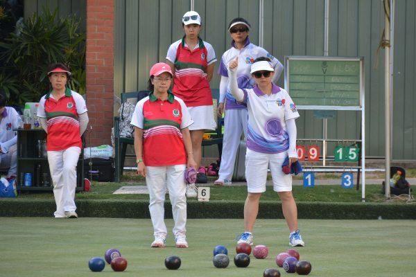 Linda Lee (in white) of Island Lawn Bowls Club applauds a good shot from her skipper. Her rink won 11:23 and helped the team to win 2-6 at Kowloon Cricket Club. ILBC remain on top of the table after winning the first three games of the campaign. (Stephanie Worth)